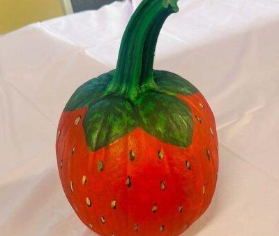 pumpkin painted to look like a strawberry